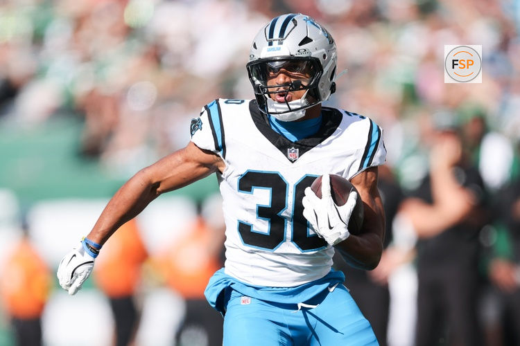 Oct 19, 2025; East Rutherford, New Jersey, USA; Carolina Panthers running back Chuba Hubbard (30) runs with the ball in the second quarter against the New York Jets at MetLife Stadium. Credit: Vincent Carchietta-Imagn Images