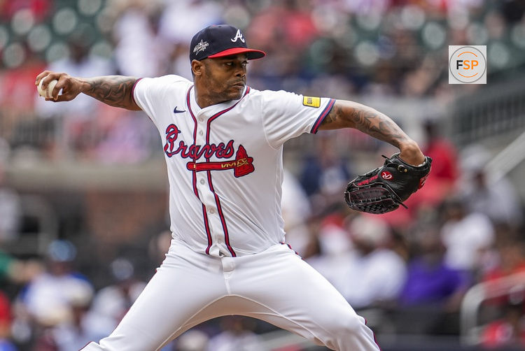 Jun 5, 2025; Cumberland, Georgia, USA; Atlanta Braves relief pitcher Raisel Iglesias (26) pitches against the Arizona Diamondbacks during the ninth inning at Truist Park. Credit: Dale Zanine-Imagn Images