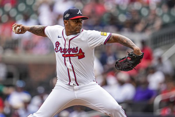 Jun 5, 2025; Cumberland, Georgia, USA; Atlanta Braves relief pitcher Raisel Iglesias (26) pitches against the Arizona Diamondbacks during the ninth inning at Truist Park. Mandatory Credit: Dale Zanine-Imagn Images