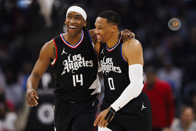 LOS ANGELES, CA - JANUARY 10: LA Clippers guard Terance Mann (14) celebrates with LA Clippers guard Russell Westbrook (0) during a NBA basketball game against the Toronto Raptors on January 10, 2024 at Crypto.com Arena in Los Angeles, CA. (Photo by Ric Tapia/Icon Sportswire)