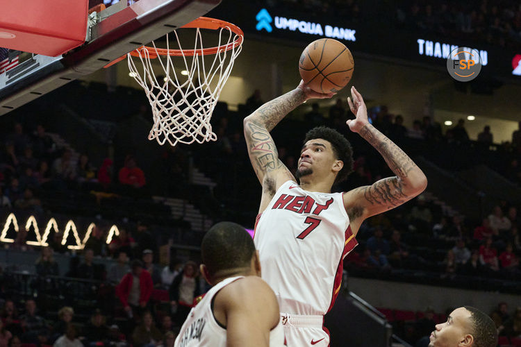 Jan 11, 2025; Portland, Oregon, USA; Miami Heat center Kel'el Ware (7) dunks the basketball during the second half against the Portland Trail Blazers at Moda Center. Credit: Troy Wayrynen-Imagn Images