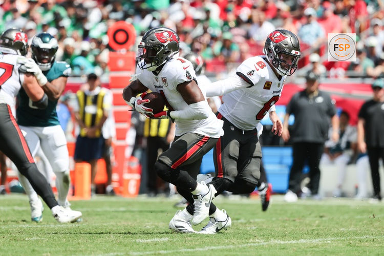 Sep 28, 2025; Tampa, Florida, USA; Tampa Bay Buccaneers running back Rachaad White (1) receives a hand off by quarterback Baker Mayfield (6) during the second quarter against the Philadelphia Eagles at Raymond James Stadium. Credit: Kim Klement Neitzel-Imagn Images