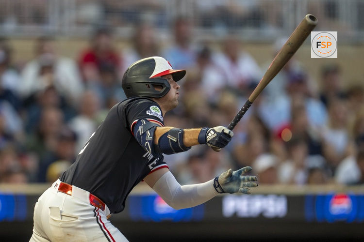 Aug 20, 2025; Minneapolis, Minnesota, USA; Minnesota Twins shortstop Brooks Lee (2) hits a RBI double against the Athletics in the fifth inning at Target Field. Credit: Jesse Johnson-Imagn Images
