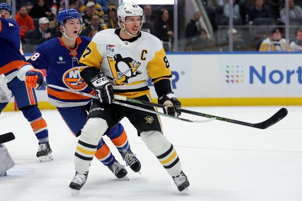 Feb 3, 2026; Elmont, New York, USA; Pittsburgh Penguins center Sidney Crosby (87) skates against New York Islanders defenseman Matthew Schaefer (48) during the first period at UBS Arena. Mandatory Credit: Brad Penner-Imagn Images