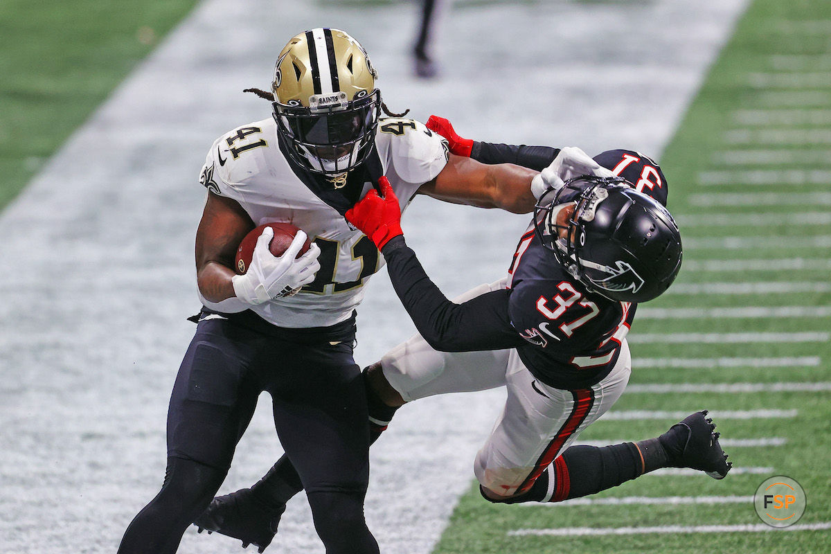 ATLANTA, GEORGIA - DECEMBER 06: Alvin Kamara #41 of the New Orleans Saints pushes offsides Ricardo Allen #37 of the Atlanta Falcons during the second quarter at Mercedes-Benz Stadium on December 06, 2020 in Atlanta, Georgia. (Photo by Kevin C. Cox/Getty Images)