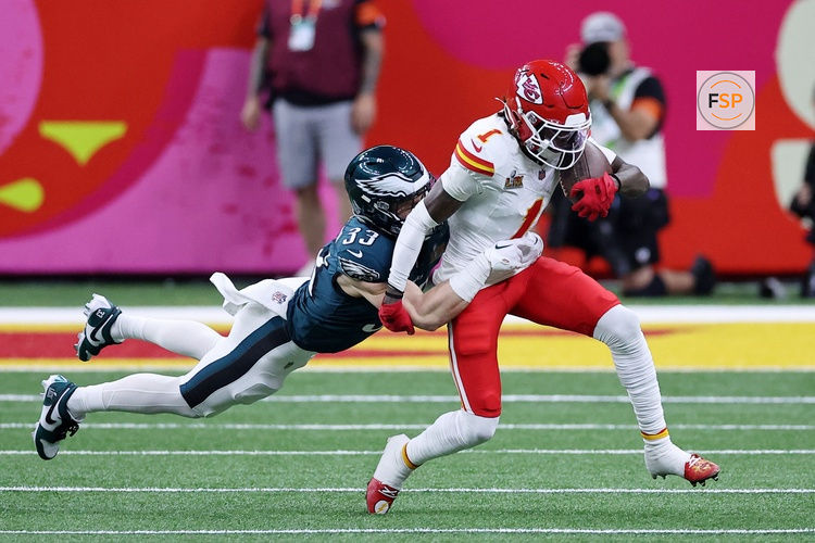 Feb 9, 2025; New Orleans, LA, USA; Kansas City Chiefs wide receiver Xavier Worthy (1) runs with the ball against Philadelphia Eagles cornerback Cooper DeJean (33) during the first half of Super Bowl LIX at Caesars Superdome. Credit: Bill Streicher-Imagn Images