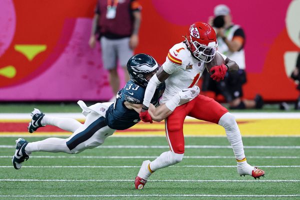 Feb 9, 2025; New Orleans, LA, USA; Kansas City Chiefs wide receiver Xavier Worthy (1) runs with the ball against Philadelphia Eagles cornerback Cooper DeJean (33) during the first half of Super Bowl LIX at Caesars Superdome. Mandatory Credit: Bill Streicher-Imagn Images
