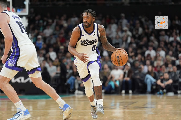 Feb 21, 2026; Austin, Texas, USA;  Sacramento Kings guard Malik Monk (0) dribbles in the second half against the San Antonio Spurs at Moody Center. Credit: Daniel Dunn-Imagn Images