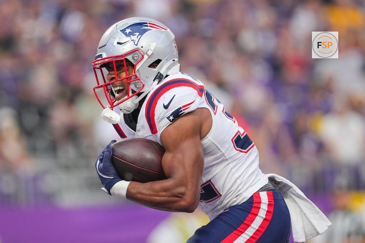 Aug 16, 2025; Minneapolis, Minnesota, USA; New England Patriots running back TreVeyon Henderson (32) celebrates his touchdown against the Minnesota Vikings in the first quarter at U.S. Bank Stadium. Credit: Brad Rempel-Imagn Images