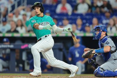 Sep 13, 2026; Miami, Florida, USA; Miami Marlins third baseman Javier Sanoja (8) hits a two-run double against the Los Angeles Dodgers during the ninth inning at loanDepot Park. Mandatory Credit: Sam Navarro-Imagn Images