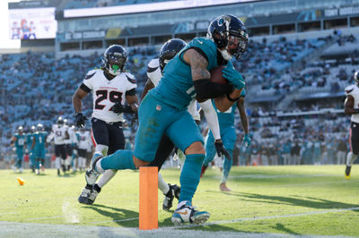 Dec 1, 2024; Jacksonville, Florida, USA; Jacksonville Jaguars wide receiver Parker Washington (11) scores a touchdown against the Houston Texans in the fourth quarter at EverBank Stadium. Mandatory Credit: Nathan Ray Seebeck-Imagn Images