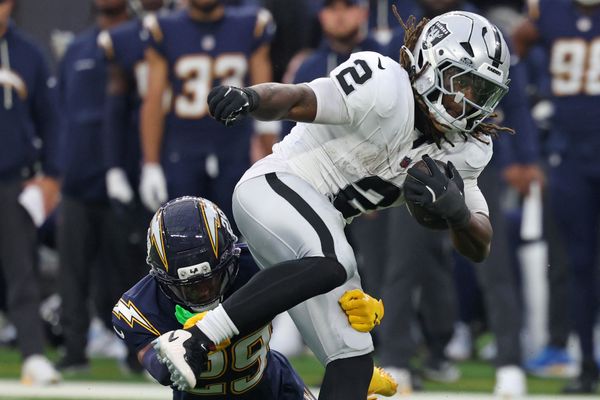 Nov 30, 2025; Inglewood, California, USA; Las Vegas Raiders running back Ashton Jeanty (2) rushes the ball past Los Angeles Chargers cornerback Tarheeb Still (29) during the second half at SoFi Stadium. Mandatory Credit: Kiyoshi Mio-Imagn Images