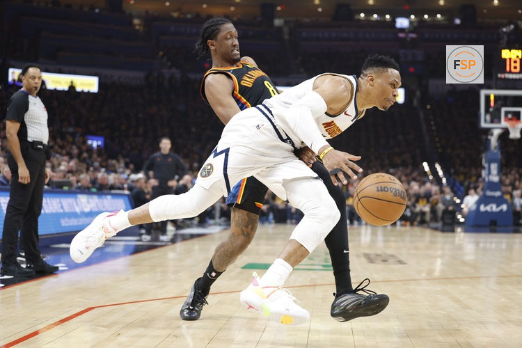 May 5, 2025; Oklahoma City, Oklahoma, USA; Denver Nuggets guard Russell Westbrook (4) drives against Oklahoma City Thunder forward Jalen Williams (8) during the second quarter during game one of the second round for the 2025 NBA Playoffs at Paycom Center. Credit: Alonzo Adams-Imagn Images