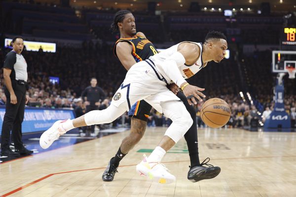 May 5, 2025; Oklahoma City, Oklahoma, USA; Denver Nuggets guard Russell Westbrook (4) drives against Oklahoma City Thunder forward Jalen Williams (8) during the second quarter during game one of the second round for the 2025 NBA Playoffs at Paycom Center. Mandatory Credit: Alonzo Adams-Imagn Images
