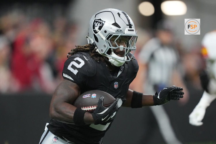 Jan 4, 2026; Paradise, Nevada, USA; Las Vegas Raiders running back Ashton Jeanty (2) carries the ball against the Kansas City Chiefs in the first half at Allegiant Stadium. Credit: Kirby Lee-Imagn Images
