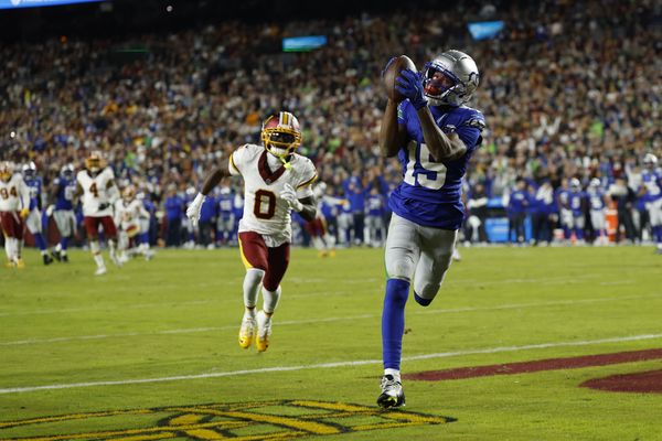Nov 2, 2025; Landover, Maryland, USA;  Seattle Seahawks wide receiver Tory Horton (15) catches a touchdown pass as Washington Commanders cornerback Mike Sainristil (0) watches during the second quarter at Northwest Stadium. Mandatory Credit: Geoff Burke-Imagn Images