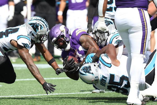 CHARLOTTE, NC - OCTOBER 01: Minnesota Vikings running back Cam Akers (31) is tackled by Carolina Panthers defensive tackle Derrick Brown (95) during an NFL football game between the Minnesota Vikings and the Carolina Panthers on October 1, 2023 at Bank of America Stadium in Charlotte, N.C. (Photo by John Byrum/Icon Sportswire)