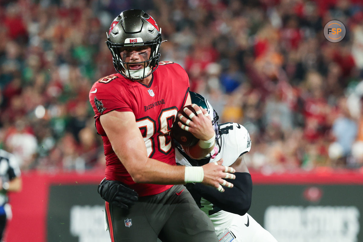 Jan 15, 2024; Tampa, Florida, USA; Tampa Bay Buccaneers tight end Cade Otton (88) breaks a tackle by Philadelphia Eagles linebacker Nicholas Morrow (41) during the first half of a 2024 NFC wild card game at Raymond James Stadium. Credit: Kim Klement Neitzel-USA TODAY Sports