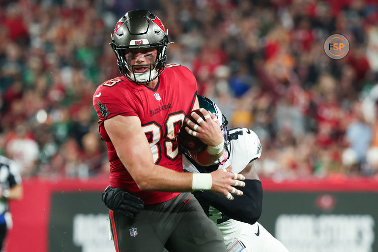 Jan 15, 2024; Tampa, Florida, USA; Tampa Bay Buccaneers tight end Cade Otton (88) breaks a tackle by Philadelphia Eagles linebacker Nicholas Morrow (41) during the first half of a 2024 NFC wild card game at Raymond James Stadium. Credit: Kim Klement Neitzel-USA TODAY Sports