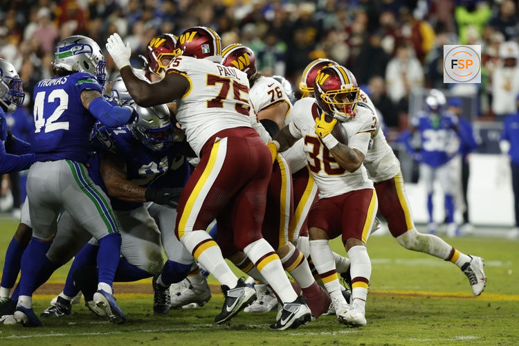 Nov 2, 2025; Landover, Maryland, USA;  Washington Commanders running back Chris Rodriguez Jr. (36) runs with the ball during the second quarter against the Seattle Seahawks at Northwest Stadium. Credit: Geoff Burke-Imagn Images