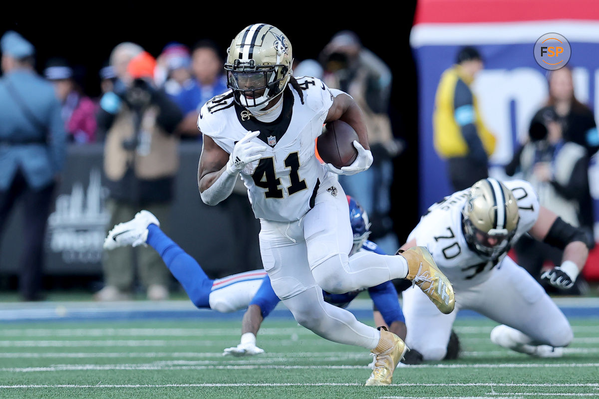 Dec 8, 2024; East Rutherford, New Jersey, USA; New Orleans Saints running back Alvin Kamara (41) runs with the ball against the New York Giants during the second quarter at MetLife Stadium. Credit: Brad Penner-Imagn Images