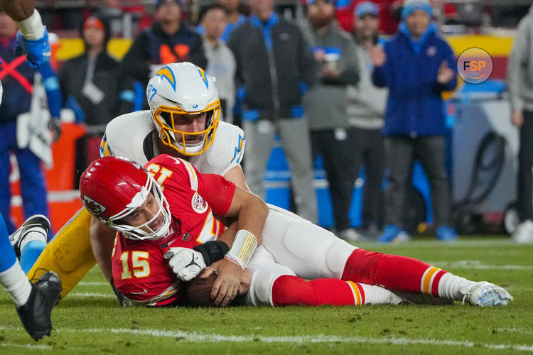 Dec 8, 2024; Kansas City, Missouri, USA; Kansas City Chiefs quarterback Patrick Mahomes (15) is sacked by Los Angeles Chargers linebacker Joey Bosa (97) during the first half at GEHA Field at Arrowhead Stadium. Credit: Denny Medley-Imagn Images