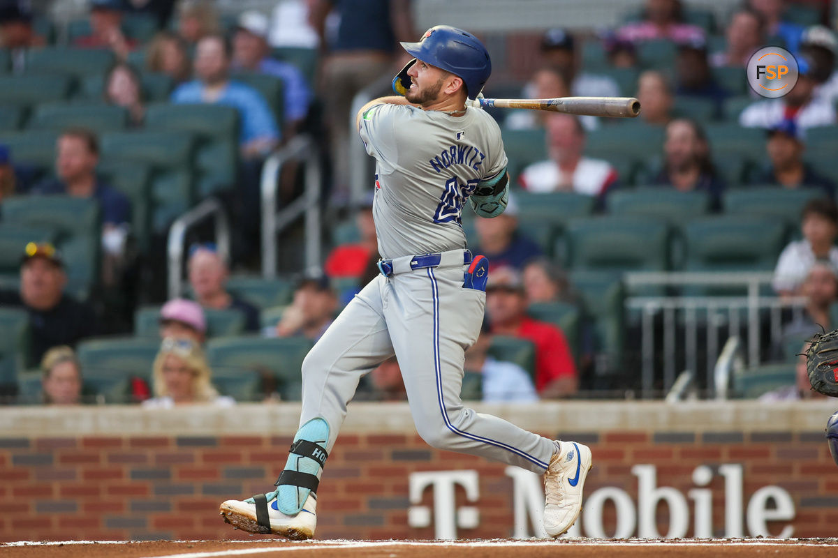 Sep 7, 2024; Atlanta, Georgia, USA; Toronto Blue Jays second baseman Spencer Horwitz (48) hits a home run against the Atlanta Braves in the second inning at Truist Park. Credit: Brett Davis-Imagn Images