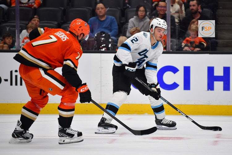 Sep 22, 2025; Anaheim, California, USA; Utah Mammoth center Tij Iginla (12) moves in for a shot against the defense of Anaheim Ducks defenseman Radko Gudas (7) during the first period at Honda Center. Credit: Gary A. Vasquez-Imagn Images