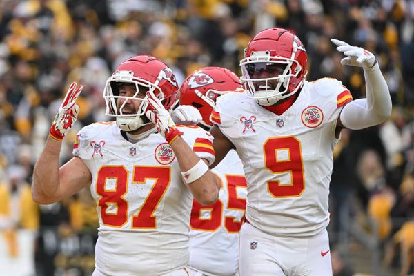 Dec 25, 2024; Pittsburgh, Pennsylvania, USA; Kansas City Chiefs tight end Travis Kelce (87) celebrates a touchdown wide receiver JuJu Smith-Schuster (9) against the Pittsburgh Steelers during the second half at Acrisure Stadium. Mandatory Credit: Barry Reeger-Imagn Images