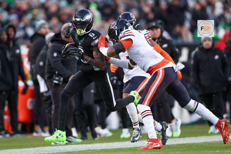 Nov 28, 2025; Philadelphia, Pennsylvania, USA; Chicago Bears safety Jaquan Brisker (9) forces Philadelphia Eagles wide receiver DeVonta Smith (6) out of bounds during the second quarter of the game at Lincoln Financial Field. Credit: Bill Streicher-Imagn Images