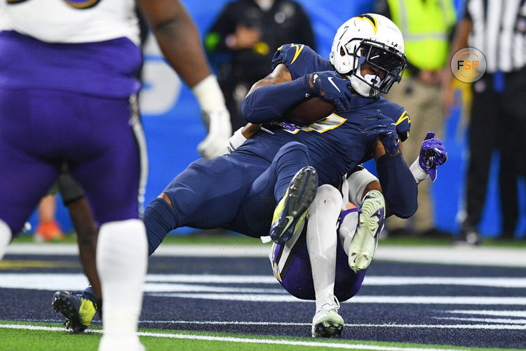 INGLEWOOD, CA - NOVEMBER 26: Los Angeles Chargers tight end Gerald Everett (7) fights his way into the end zone for a touchdown during the NFL regular season game between the Baltimore Ravens and the Los Angeles Chargers on November 26, 2023, at SoFi Stadium in Inglewood, CA. (Photo by Brian Rothmuller/Icon Sportswire)