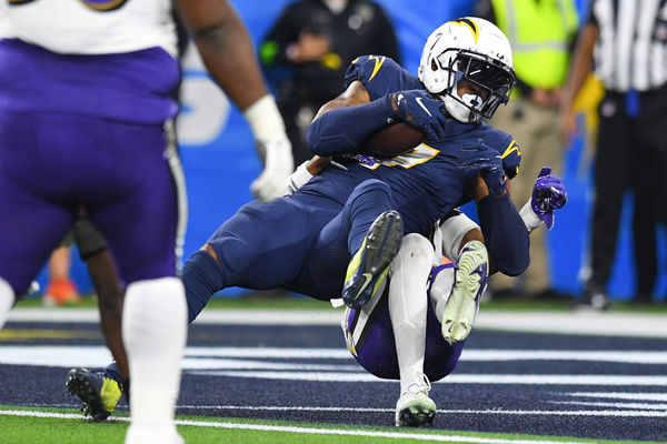 INGLEWOOD, CA - NOVEMBER 26: Los Angeles Chargers tight end Gerald Everett (7) fights his way into the end zone for a touchdown during the NFL regular season game between the Baltimore Ravens and the Los Angeles Chargers on November 26, 2023, at SoFi Stadium in Inglewood, CA. (Photo by Brian Rothmuller/Icon Sportswire)