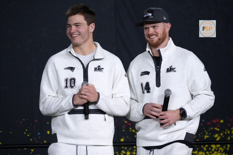 Feb 2, 2026; San Jose, CA, USA; Seattle Seahawks quarterback Sam Darnold (14) and New England Patriots quarterback Drake Maye (10) during Opening Night for Super Bowl LX at San Jose Convention Center. Credit: Kirby Lee-Imagn Images