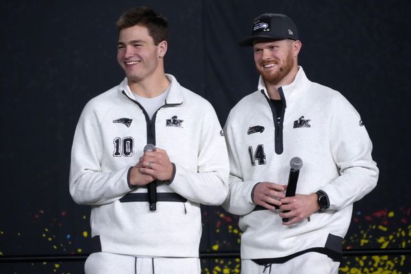 Feb 2, 2026; San Jose, CA, USA; Seattle Seahawks quarterback Sam Darnold (14) and New England Patriots quarterback Drake Maye (10) during Opening Night for Super Bowl LX at San Jose Convention Center. Mandatory Credit: Kirby Lee-Imagn Images