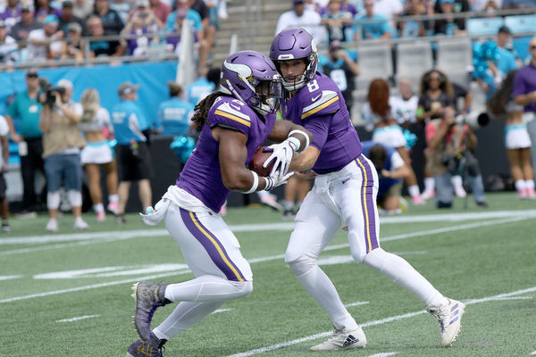 CHARLOTTE, NC - OCTOBER 01: Minnesota Vikings running back Alexander Mattison (2) and Minnesota Vikings quarterback Kirk Cousins (8) during an NFL football game between the Minnesota Vikings and the Carolina Panthers on October 1, 2023 at Bank of America Stadium in Charlotte, N.C. (Photo by John Byrum/Icon Sportswire)