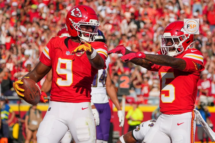Sep 28, 2025; Kansas City, Missouri, USA; Kansas City Chiefs wide receiver Juju Smith-Schuster (9) celebrates with wide receiver Marquise Brown (5) against the Baltimore Ravens after scoring during the game at GEHA Field at Arrowhead Stadium. Credit: Denny Medley-Imagn Images