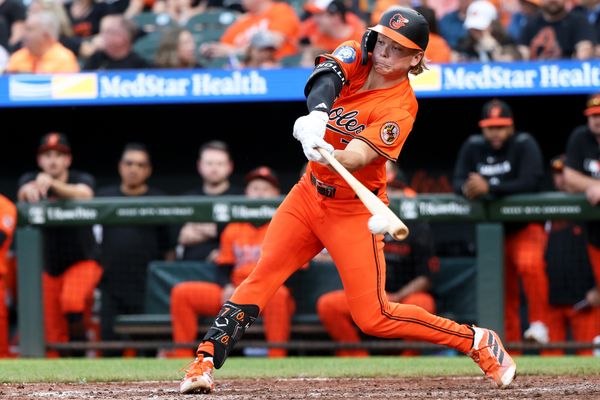 Apr 19, 2025; Baltimore, Maryland, USA; Baltimore Orioles second baseman Jackson Holliday (7) hits a single during the seventh inning against the Cincinnati Reds at Oriole Park at Camden Yards. Mandatory Credit: Daniel Kucin Jr.-Imagn Images