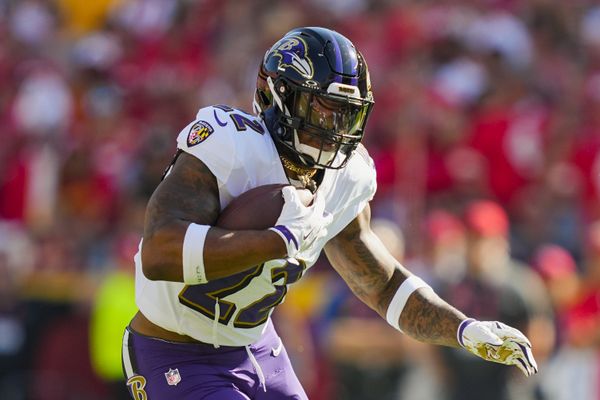 Sep 28, 2025; Kansas City, Missouri, USA; Baltimore Ravens running back Derrick Henry (22) runs the ball during the first half against the Kansas City Chiefs at GEHA Field at Arrowhead Stadium. Mandatory Credit: Jay Biggerstaff-Imagn Images