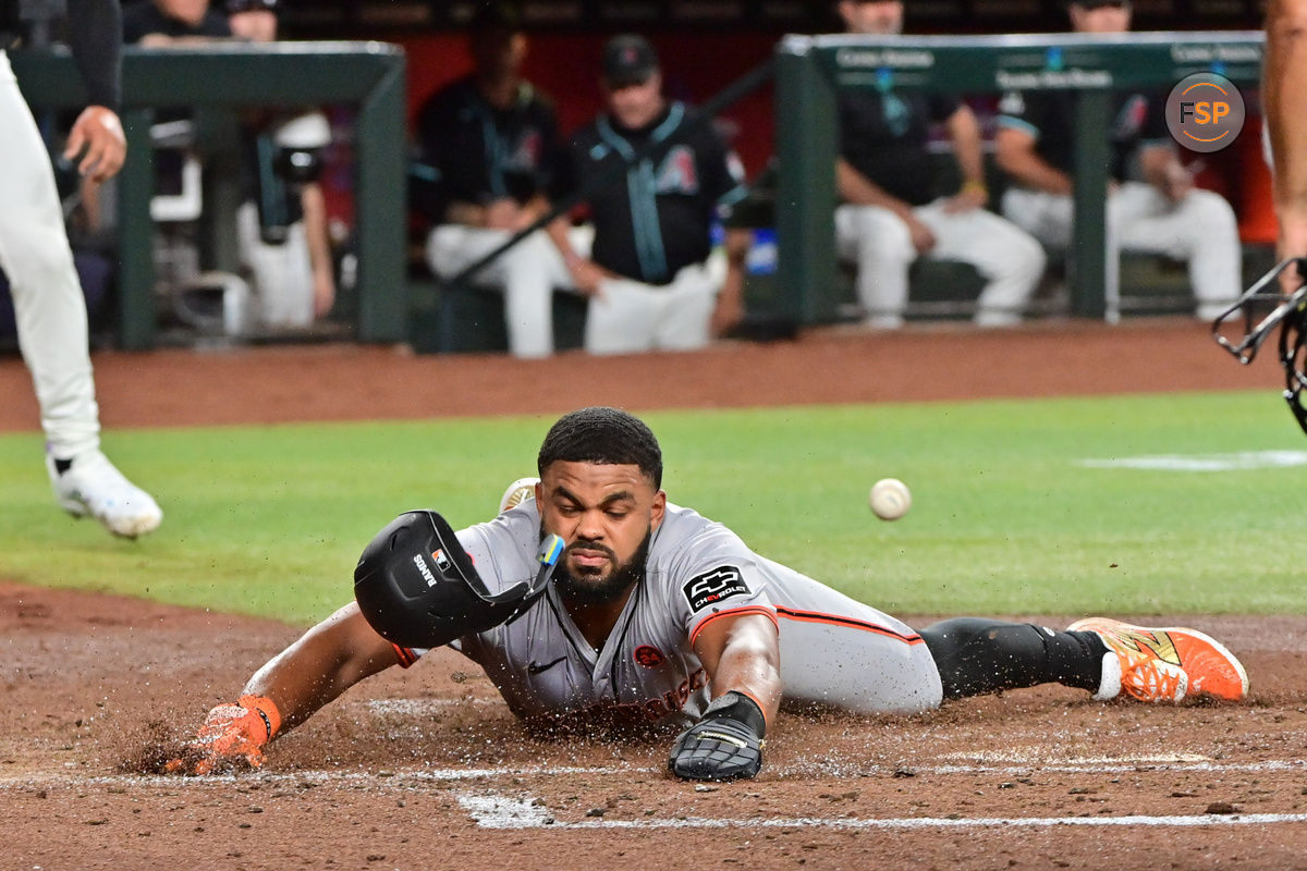 Sep 23, 2024; Phoenix, Arizona, USA;  San Francisco Giants outfielder Heliot Ramos (17) scores during the third inning against the Arizona Diamondbacks at Chase Field. Credit: Matt Kartozian-Imagn Images