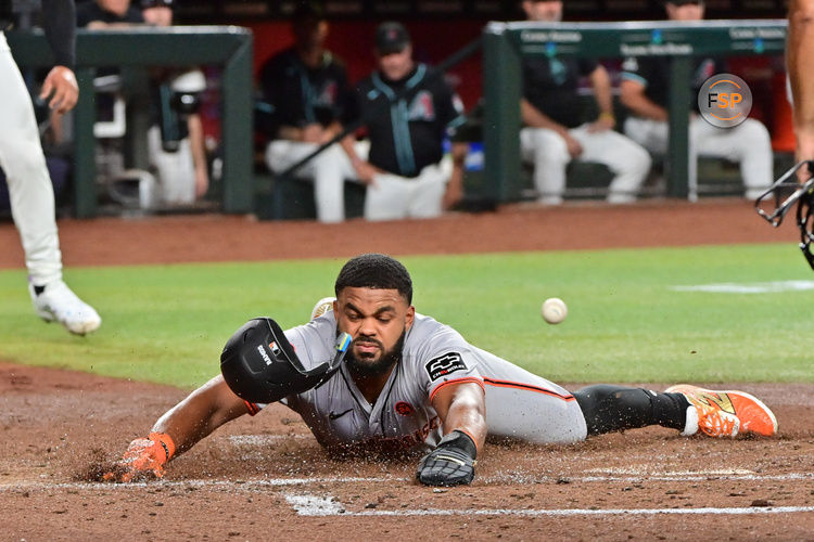 Sep 23, 2024; Phoenix, Arizona, USA;  San Francisco Giants outfielder Heliot Ramos (17) scores during the third inning against the Arizona Diamondbacks at Chase Field. Credit: Matt Kartozian-Imagn Images