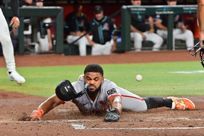 Sep 23, 2024; Phoenix, Arizona, USA;  San Francisco Giants outfielder Heliot Ramos (17) scores during the third inning against the Arizona Diamondbacks at Chase Field. Mandatory Credit: Matt Kartozian-Imagn Images