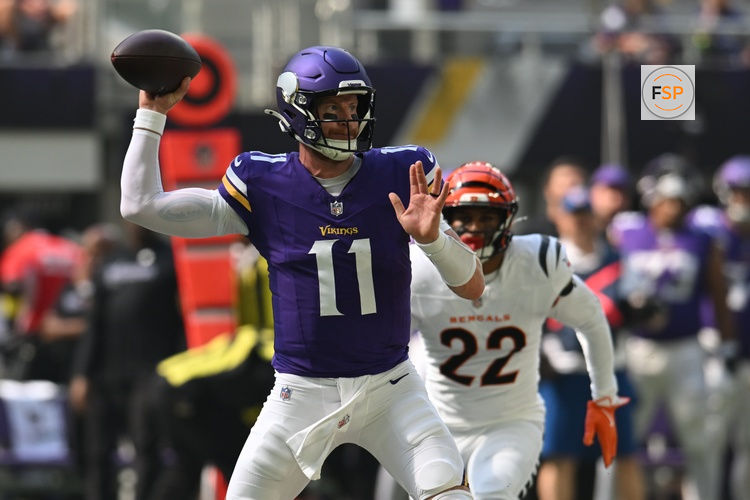 Sep 21, 2025; Minneapolis, Minnesota, USA; Minnesota Vikings quarterback Carson Wentz (11) throws downfield against the Cincinnati Bengals during the first half at U.S. Bank Stadium. Credit: Jeffrey Becker-Imagn Images