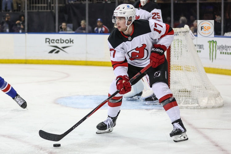 Mar 31, 2026; New York, New York, USA;  New Jersey Devils defenseman Simon Nemec (17) controls the puck in the second period against the New York Rangers at Madison Square Garden. Credit: Wendell Cruz-Imagn Images