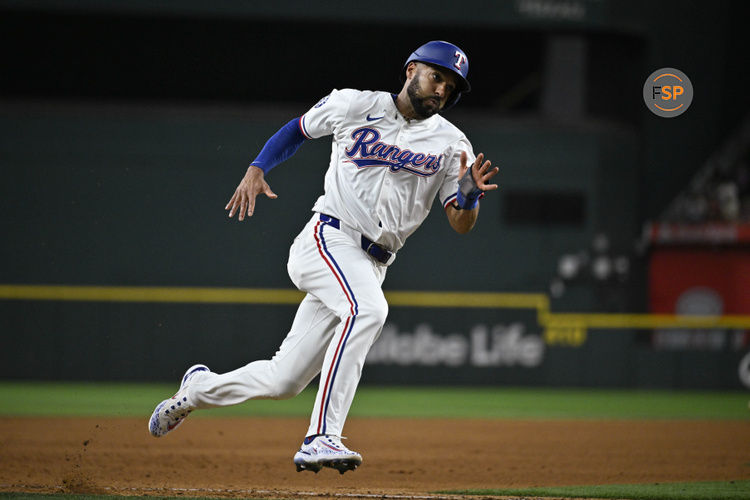 Sep 17, 2024; Arlington, Texas, USA; Texas Rangers second baseman Marcus Semien (2) scores against the Toronto Blue Jays during the fourth inning at Globe Life Field. Credit: Jerome Miron-Imagn Images