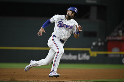 Sep 17, 2024; Arlington, Texas, USA; Texas Rangers second baseman Marcus Semien (2) scores against the Toronto Blue Jays during the fourth inning at Globe Life Field. Mandatory Credit: Jerome Miron-Imagn Images