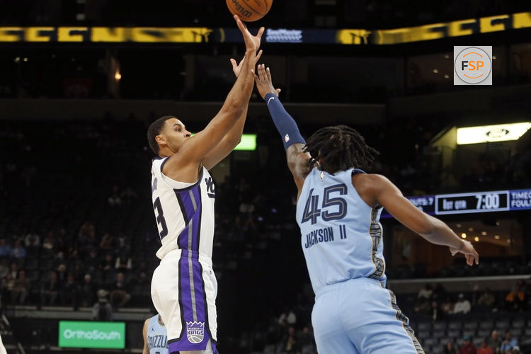 Feb 23, 2026; Memphis, Tennessee, USA; Sacramento Kings forward Keegan Murray (13) shoots as Memphis Grizzlies forward GG Jackson (45) defends during the first quarter at FedExForum. Credit: Petre Thomas-Imagn Images