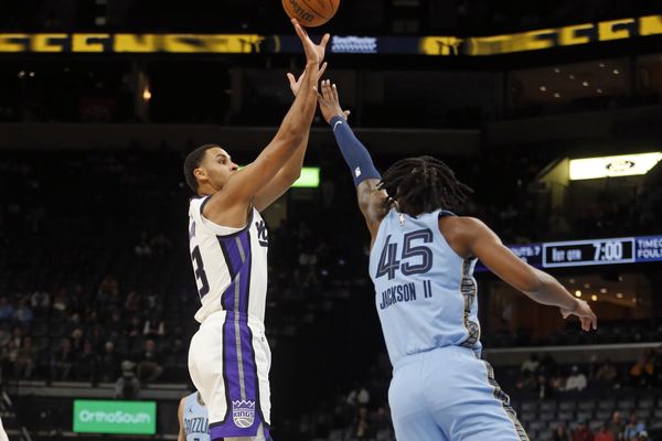 Feb 23, 2026; Memphis, Tennessee, USA; Sacramento Kings forward Keegan Murray (13) shoots as Memphis Grizzlies forward GG Jackson (45) defends during the first quarter at FedExForum. Mandatory Credit: Petre Thomas-Imagn Images