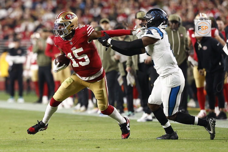 Nov 24, 2025; Santa Clara, California, USA; San Francisco 49ers wide receiver Jauan Jennings (15) makes a catch against Carolina Panthers cornerback Mike Jackson (2) during the second half at Levi's Stadium. Credit: Kelley L Cox-Imagn Images