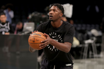 Nov 19, 2024; Brooklyn, New York, USA; Brooklyn Nets forward Dorian Finney-Smith (28) warms up before a game against the Charlotte Hornets at Barclays Center. Mandatory Credit: Brad Penner-Imagn Images