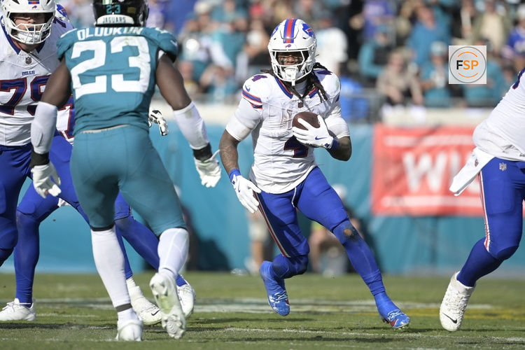 Jan 11, 2026; Jacksonville, FL, USA; Buffalo Bills running back James Cook III (4) carries the ball during the second half against the Jacksonville Jaguars in an AFC Wild Card Round game at EverBank Stadium. Credit: Melina Myers-Imagn Images